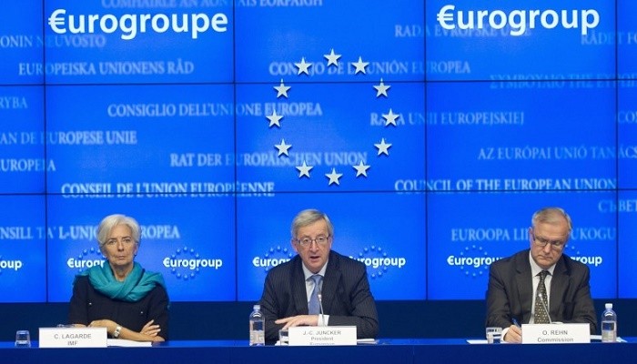 From L-R: International Monetary Fund (IMF) Managing Director Christine Lagarde, Luxembourg's Prime Minister and Eurogroup chairman Jean-Claude Juncker and European Economic and Monetary Affairs Commissioner Olli Rehn address a joint news conference after a euro zone finance ministers meeting in Brussels November 27, 2012. Euro zone finance ministers and the International Monetary Fund clinched agreement on reducing Greece's debt on Monday in a breakthrough to release urgently needed loans to keep the near-bankrupt economy afloat. REUTERS/Jock Fistick/Pool (BELGIUM - Tags: POLITICS BUSINESS)